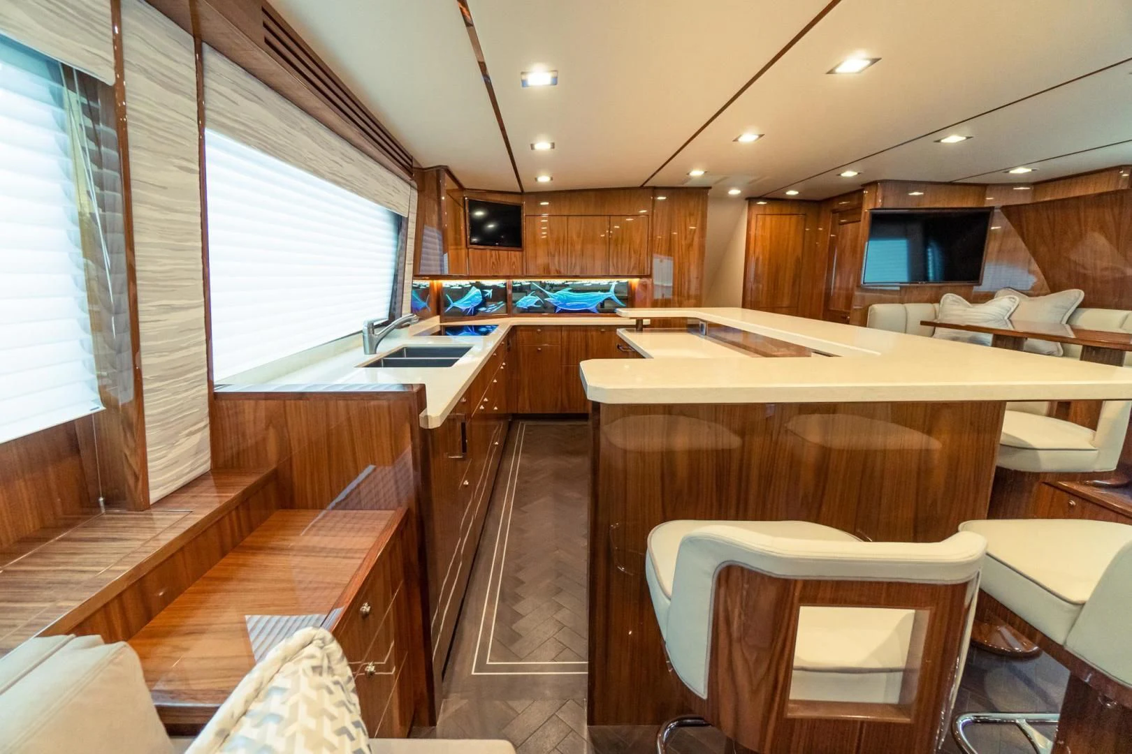 a large kitchen with wooden cabinets aboard TAG TEAM Yacht for Sale