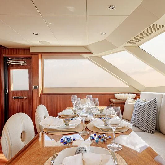a dining room with a table set aboard RHYTHM'N BLUES Yacht for Sale