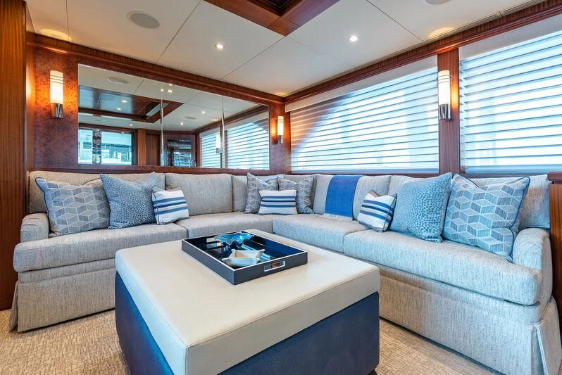 a living room with a couch and a coffee table aboard RHYTHM'N BLUES Yacht for Sale