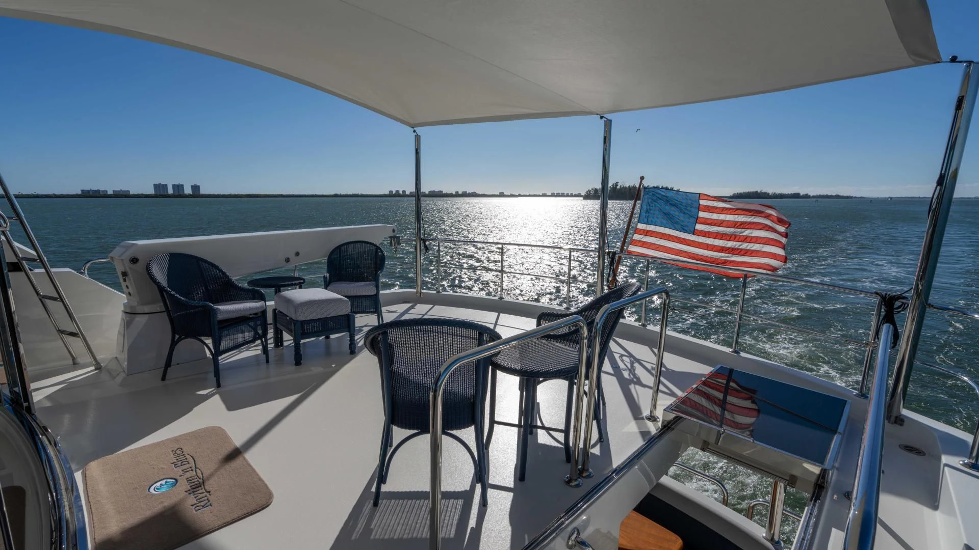 a boat with chairs and tables on it aboard RHYTHM'N BLUES Yacht for Sale