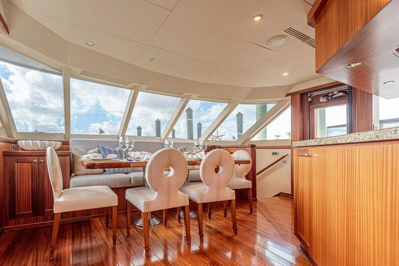 a dining room with a table aboard RHYTHM'N BLUES Yacht for Sale