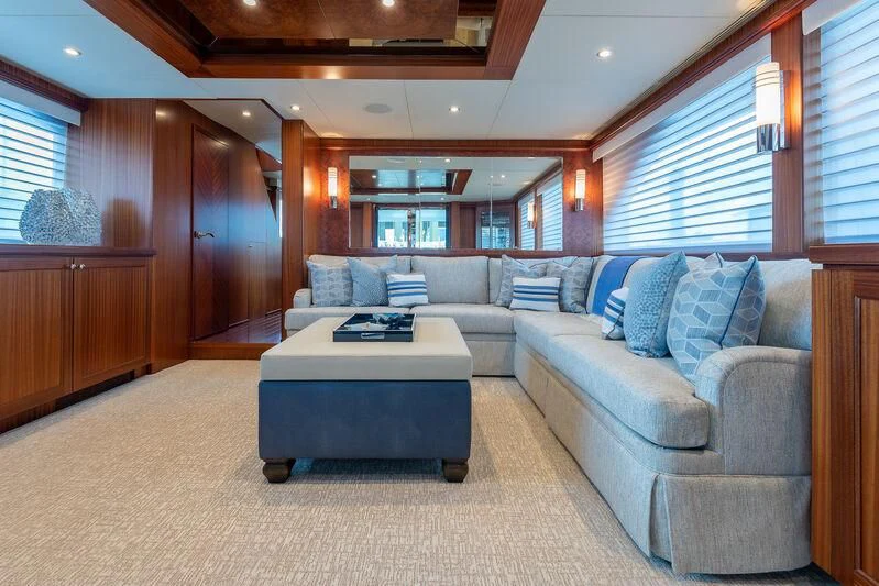 a living room with a couch and a table aboard RHYTHM'N BLUES Yacht for Sale