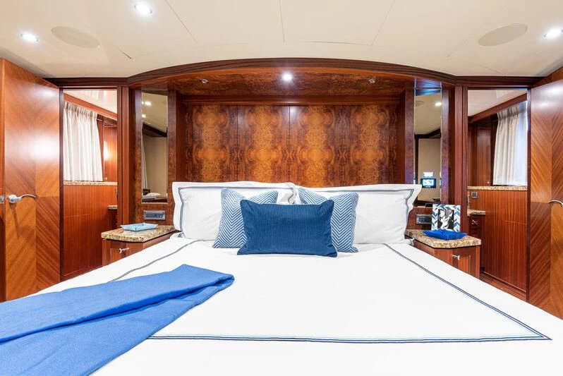 a bed with white sheets aboard RHYTHM'N BLUES Yacht for Sale