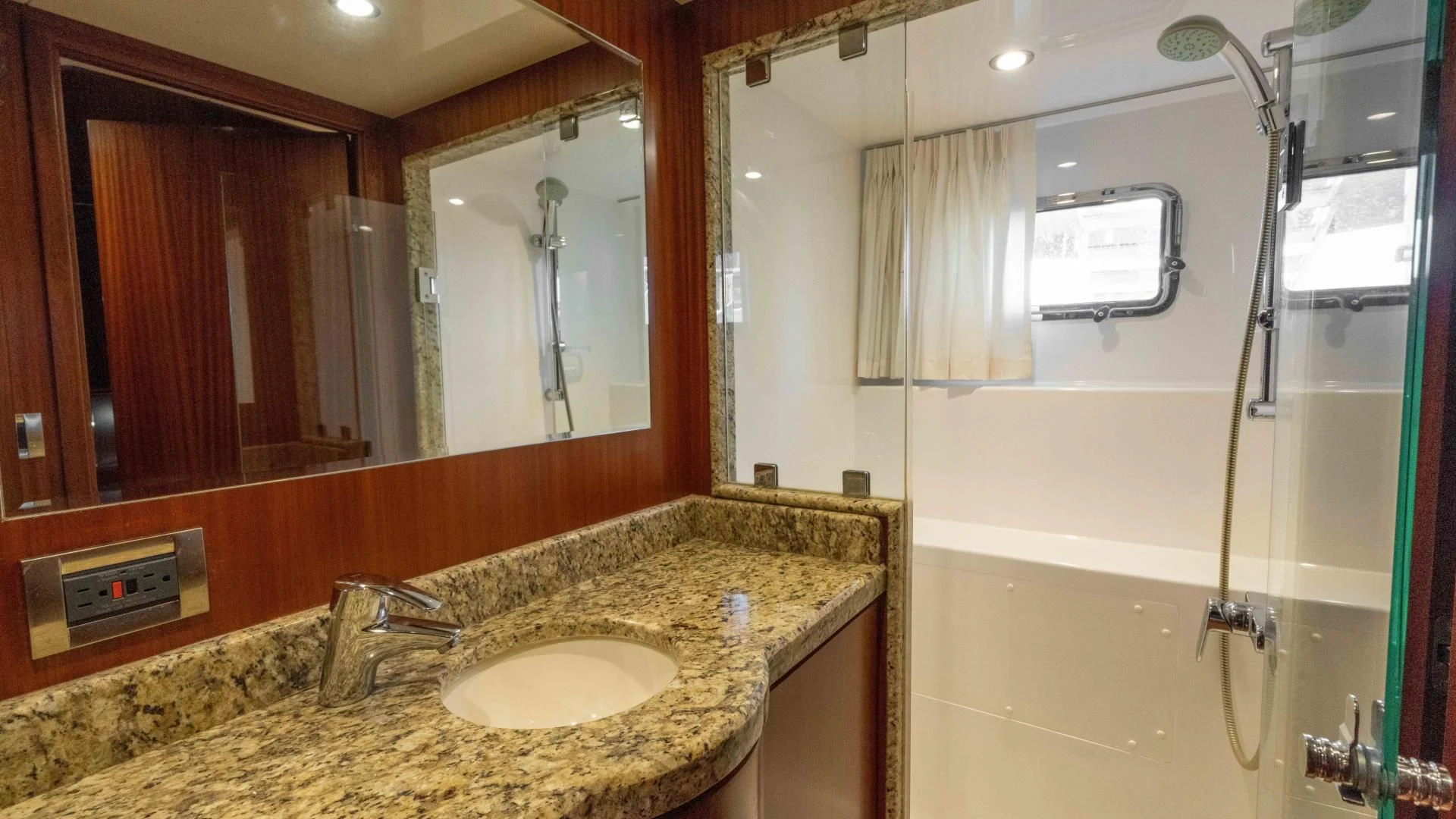 a bathroom with a large mirror aboard RHYTHM'N BLUES Yacht for Sale