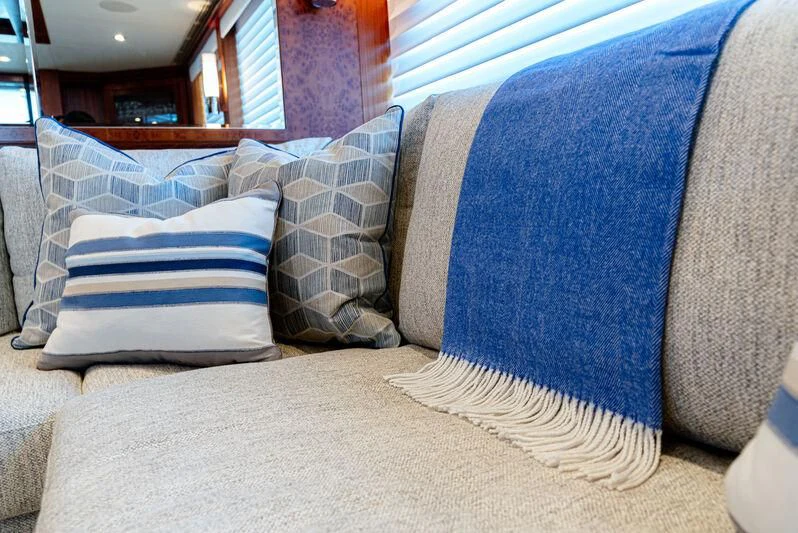 a couch with pillows aboard RHYTHM'N BLUES Yacht for Sale