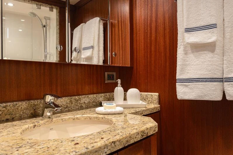 a bathroom with a sink and mirror aboard RHYTHM'N BLUES Yacht for Sale