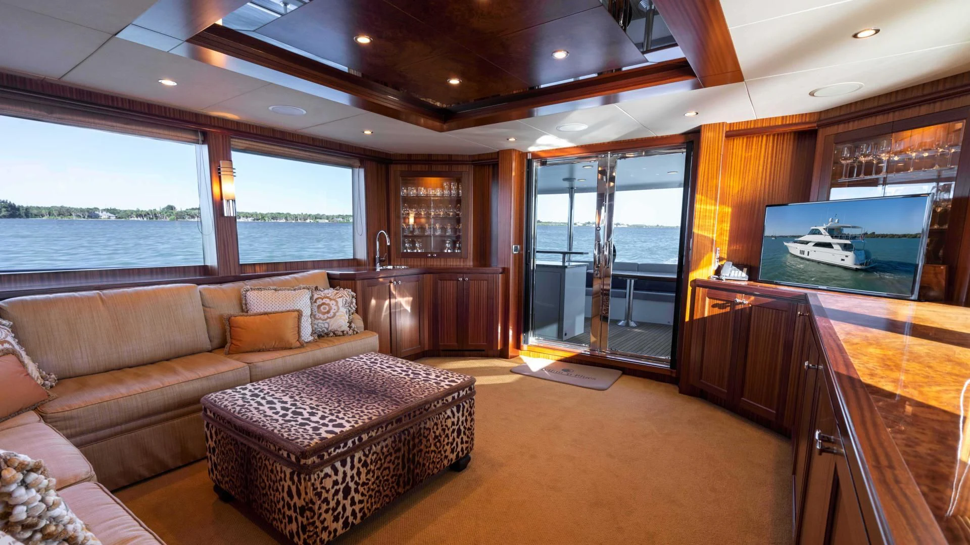 a living room with a large window aboard RHYTHM'N BLUES Yacht for Sale