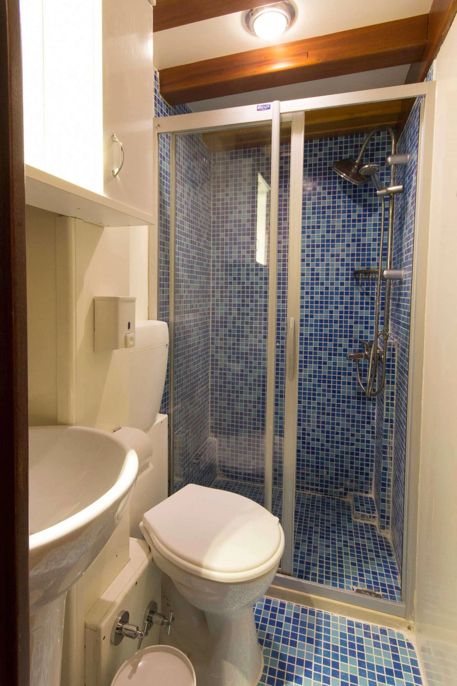 a bathroom with a glass shower aboard ATHENA Yacht for Sale