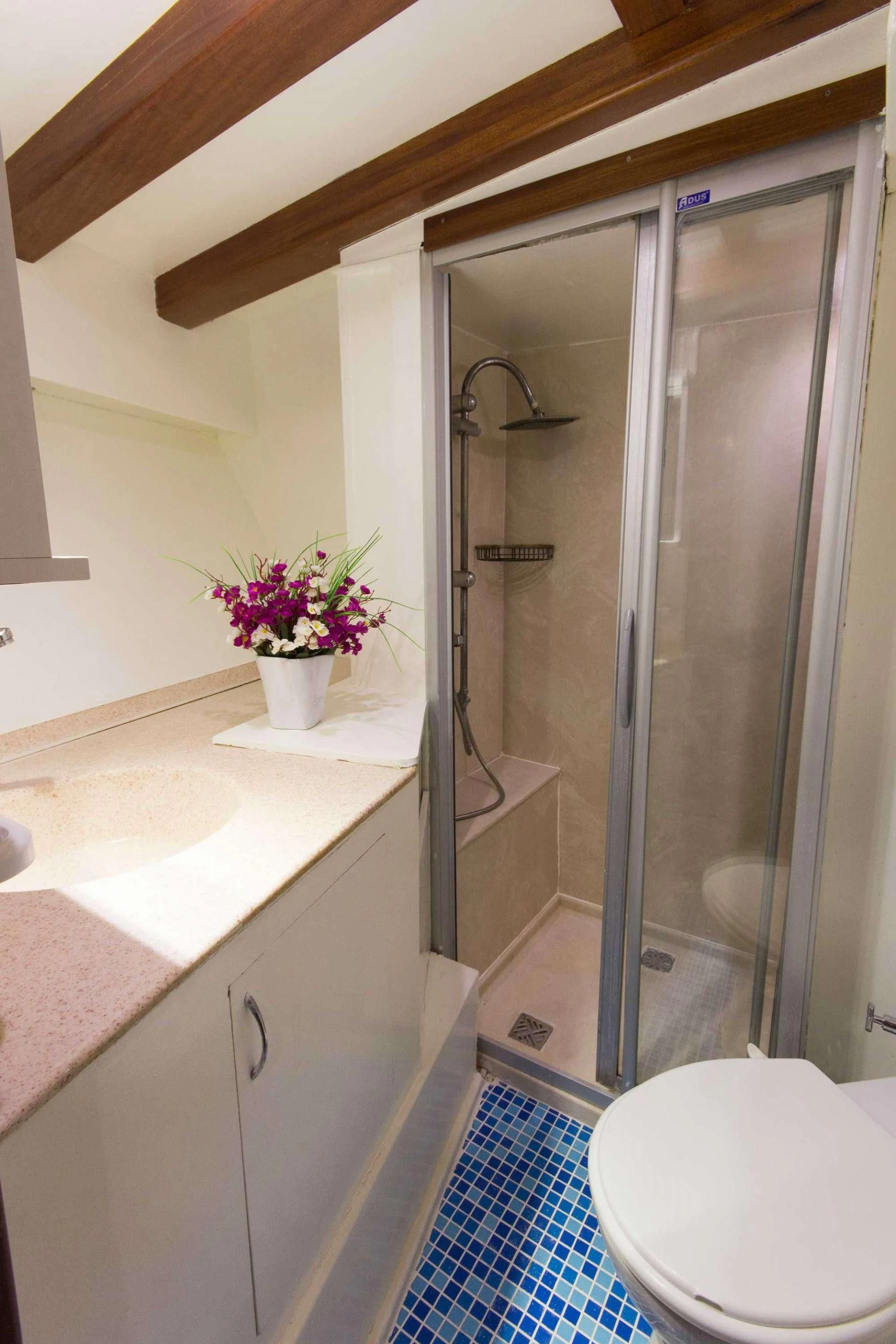 a bathroom with a glass shower aboard ATHENA Yacht for Sale