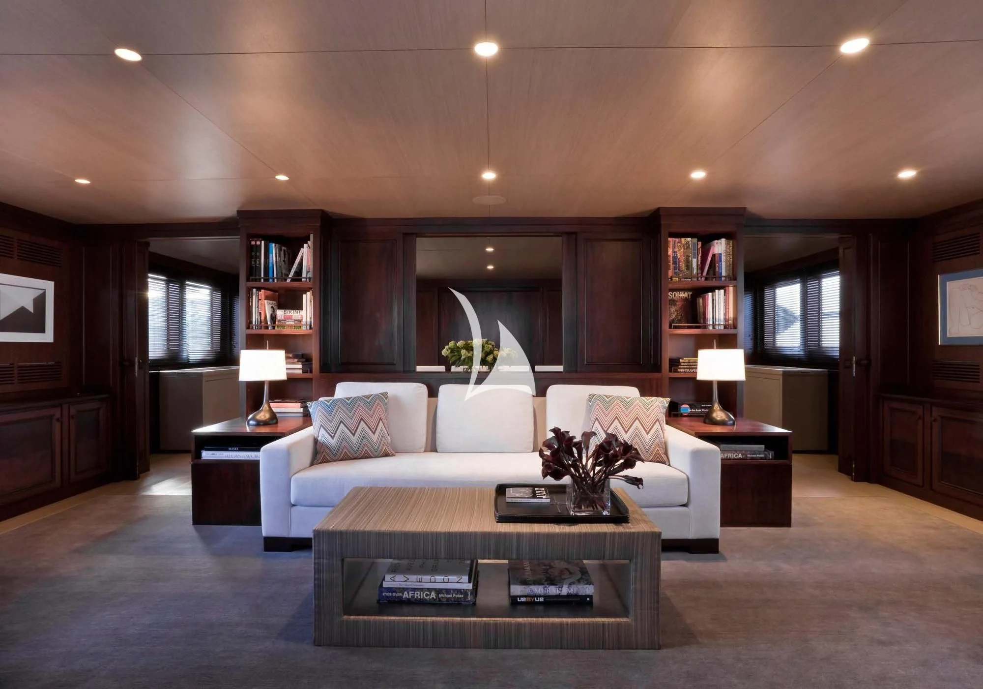 a living room with a couch and a coffee table aboard CYAN Yacht for Sale