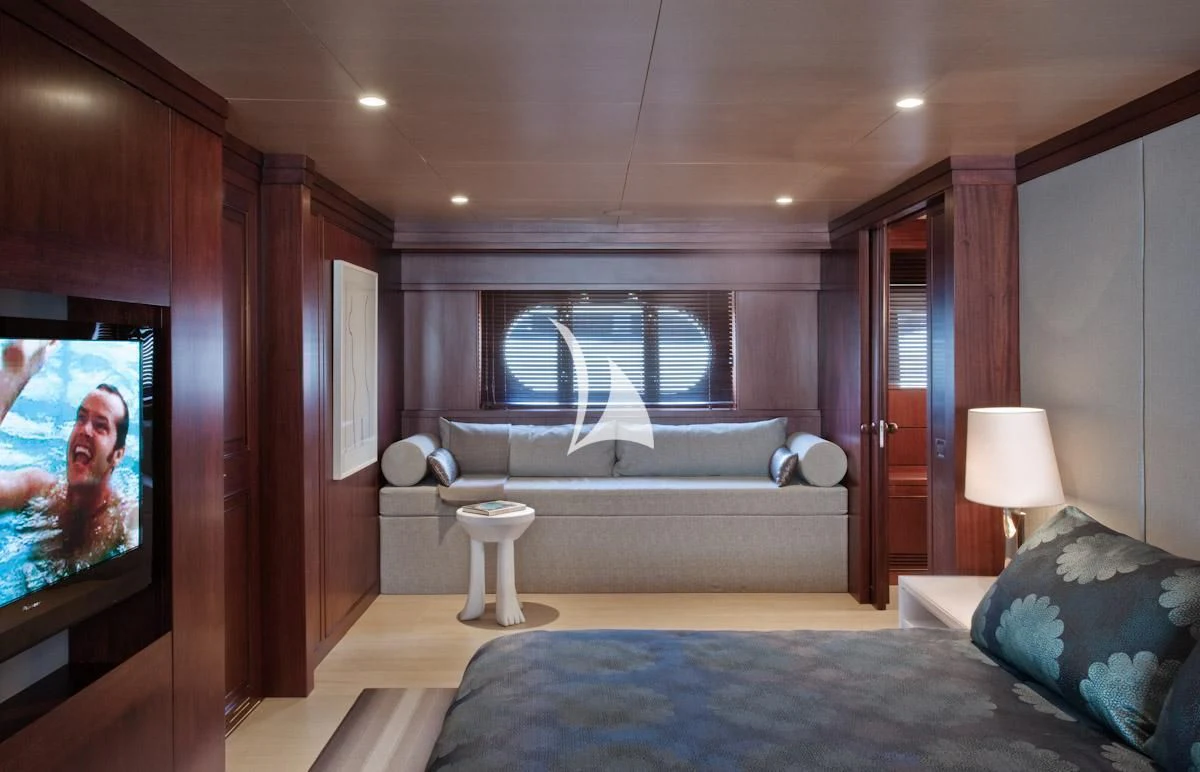 a bed in a room aboard CYAN Yacht for Sale