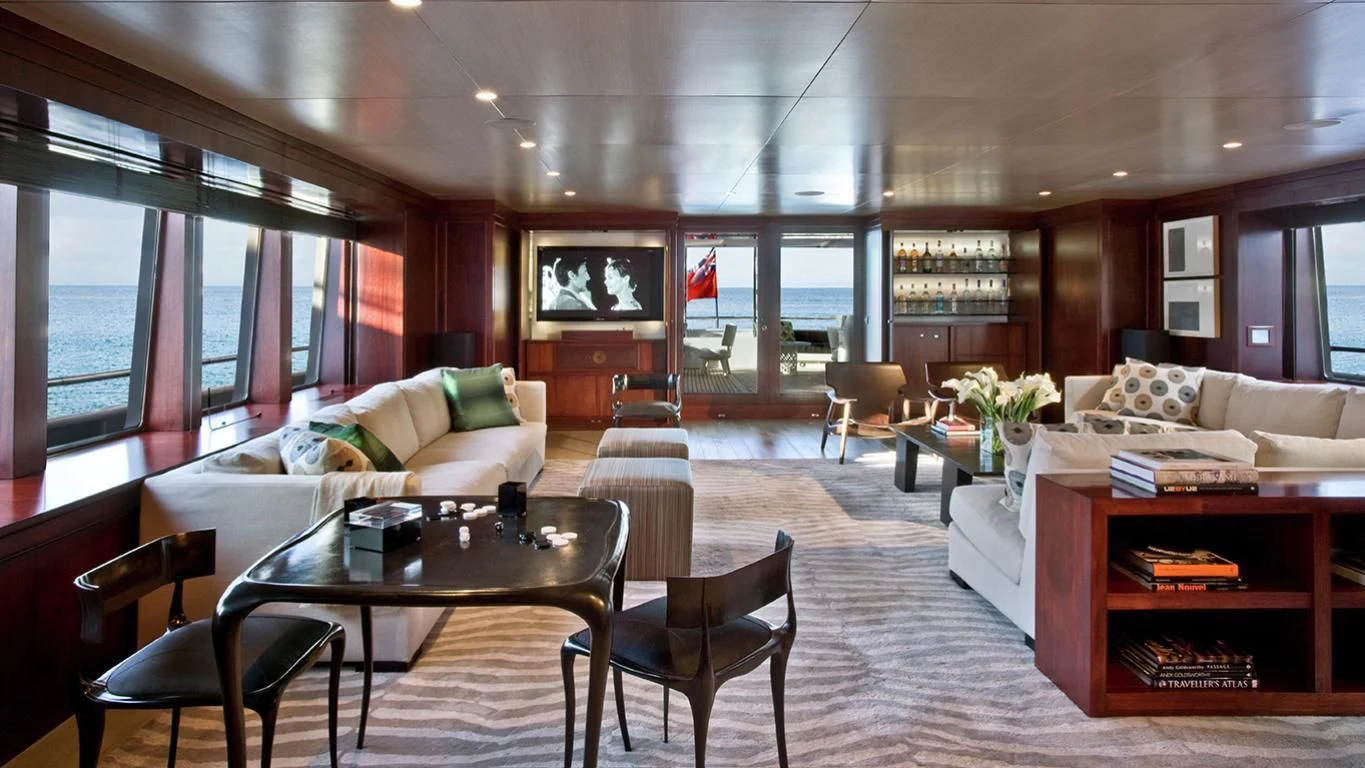 a living room with a large window aboard CYAN Yacht for Sale