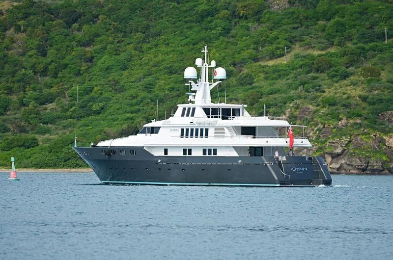 a large ship in the water aboard CYAN Yacht for Sale