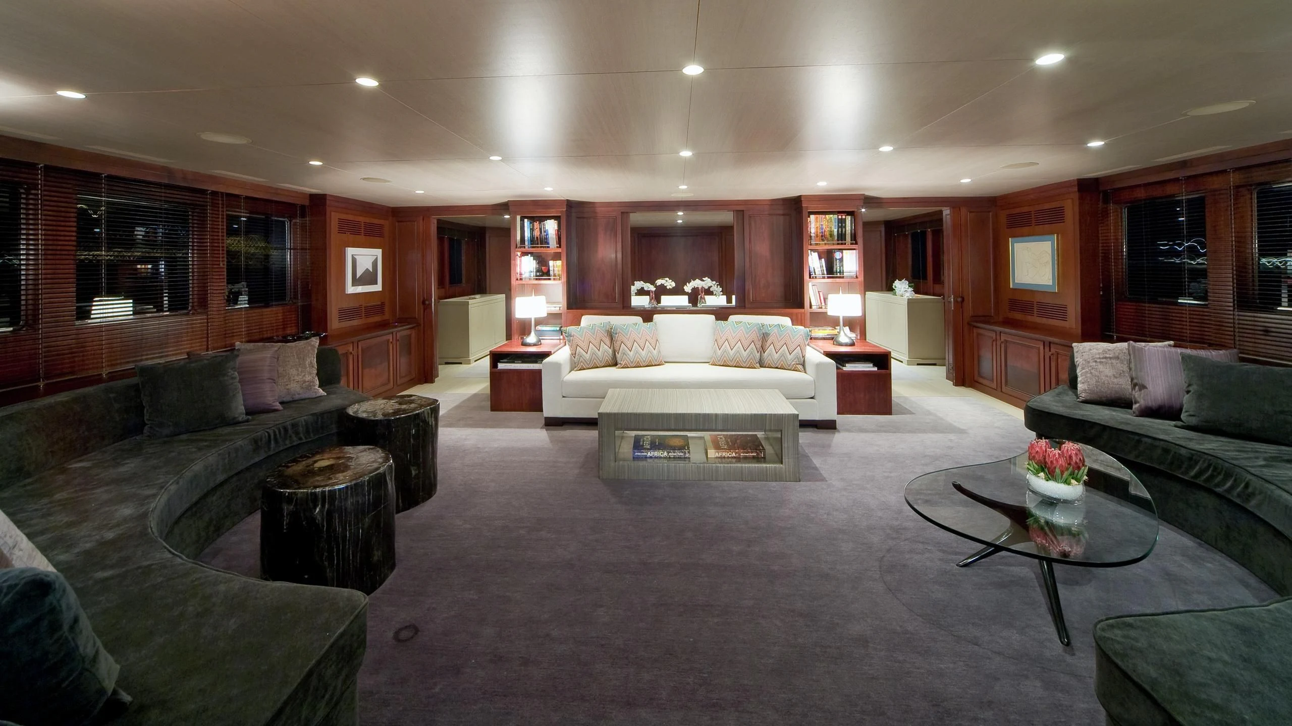 a living room with a couch and a coffee table aboard CYAN Yacht for Sale