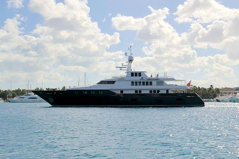 a large boat in the water aboard CYAN Yacht for Sale