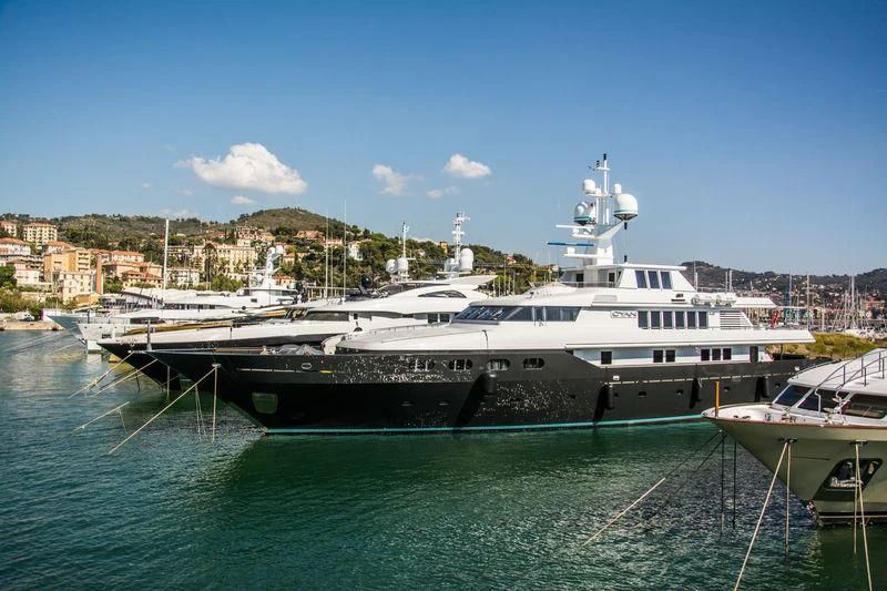 a boat docked at a pier aboard CYAN Yacht for Sale