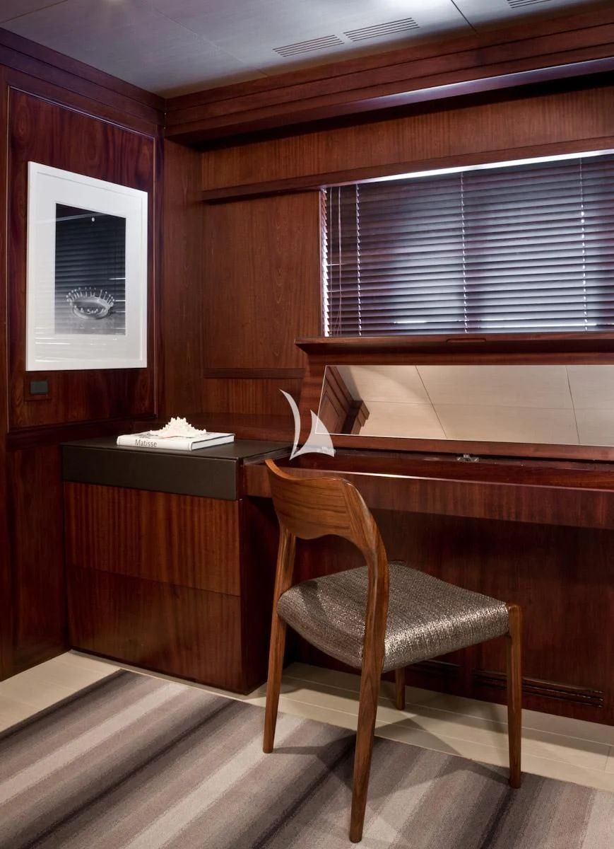 a chair in a room aboard CYAN Yacht for Sale