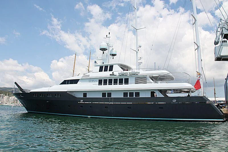 a large boat in the water aboard CYAN Yacht for Sale