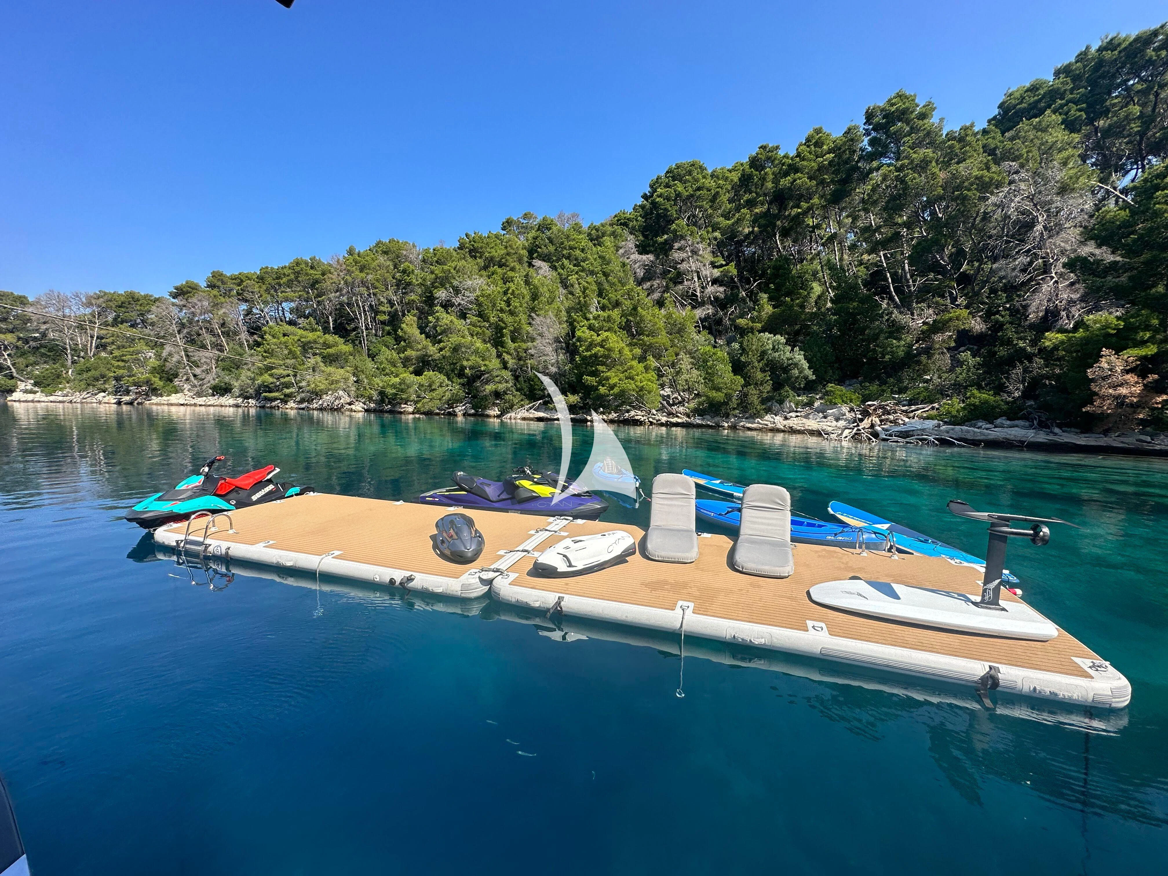 a group of boats on a body of water aboard CYAN Yacht for Sale