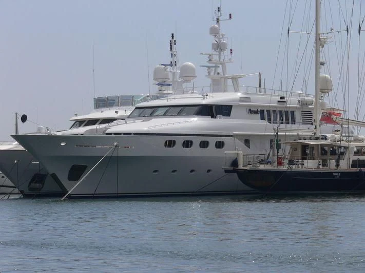 a couple of large boats in the water aboard CYAN Yacht for Sale