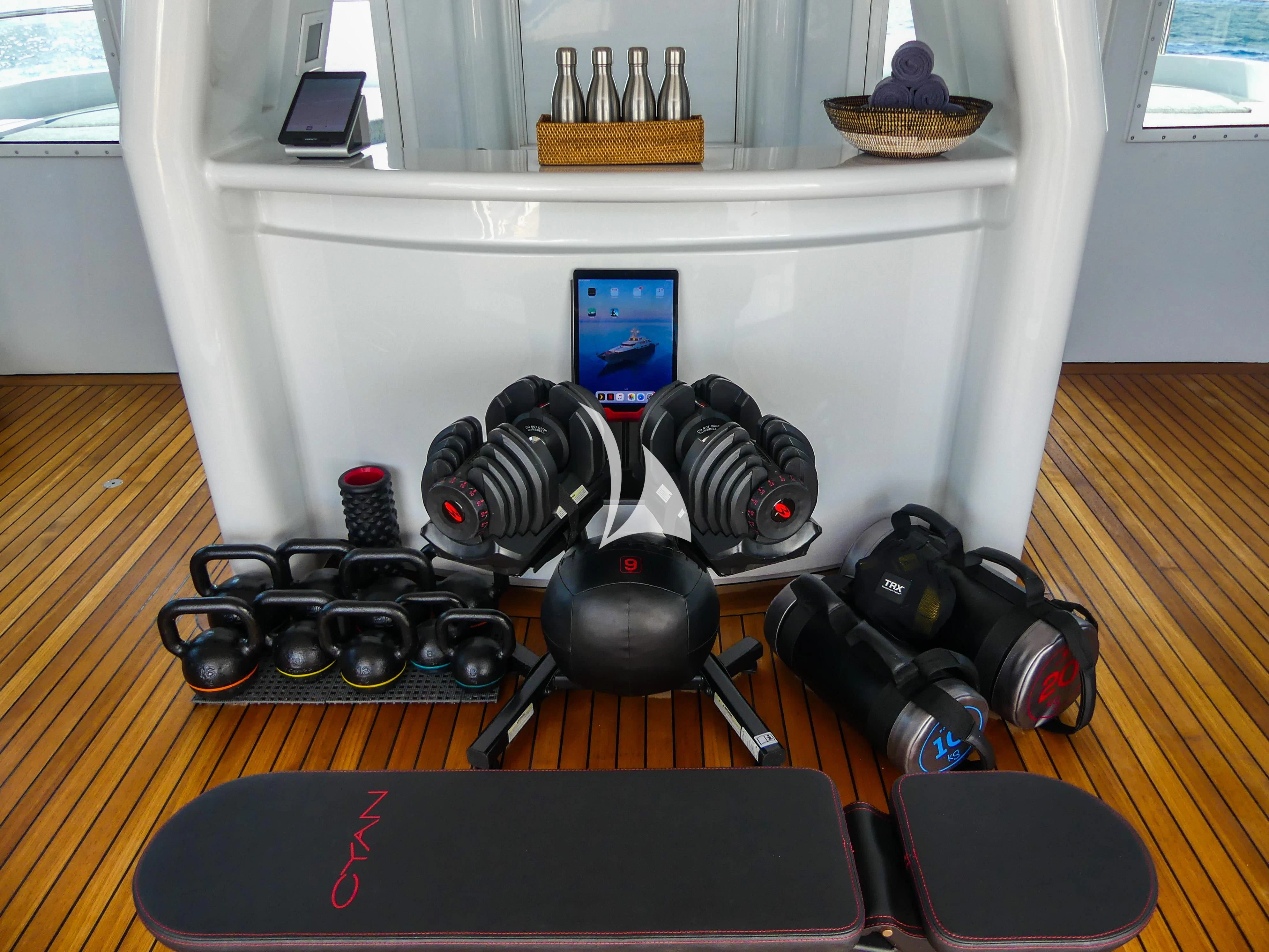 a group of headphones on a table aboard CYAN Yacht for Sale