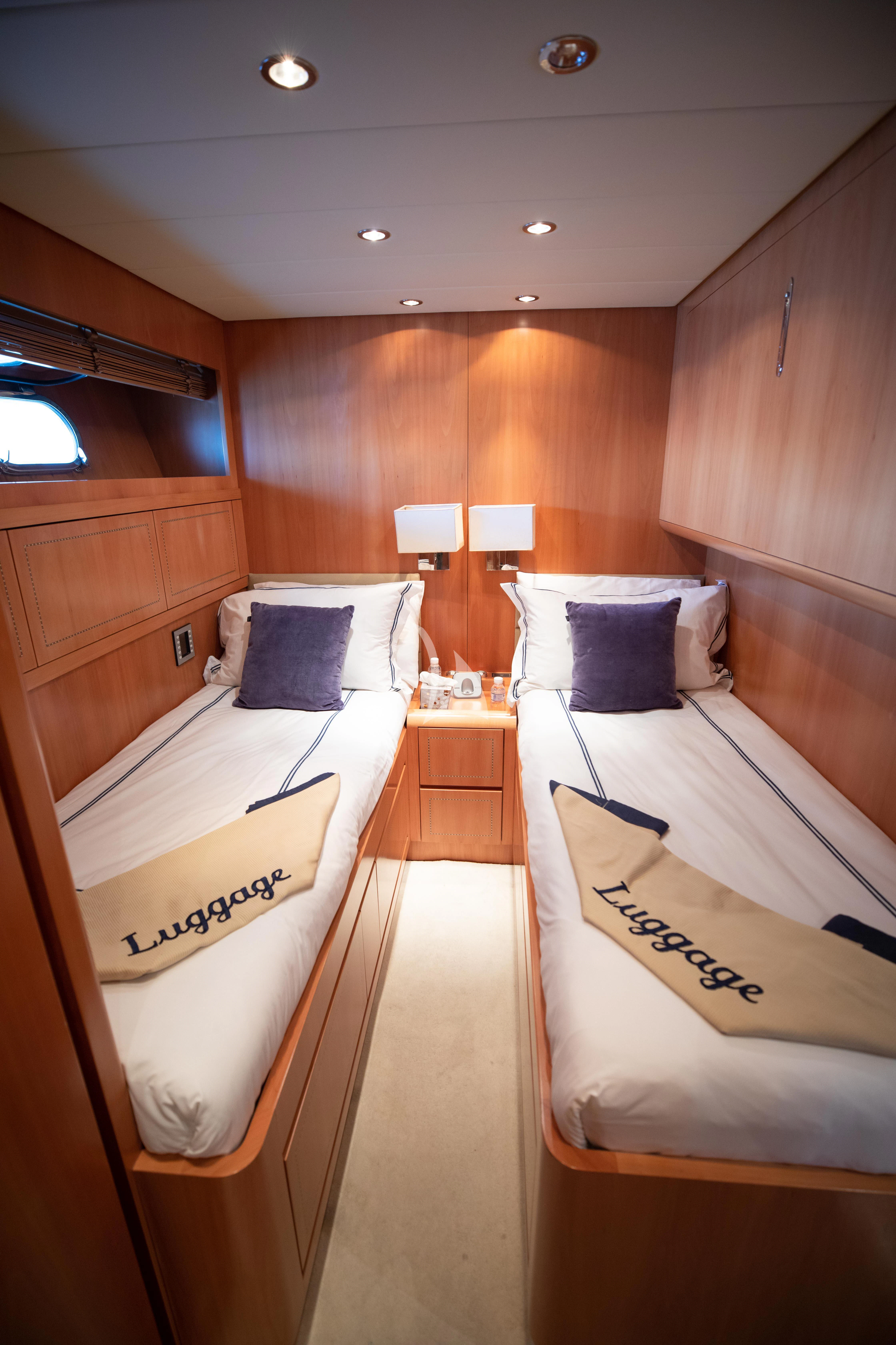 a room with a bed and a wood wall aboard ELLERY A Yacht for Sale