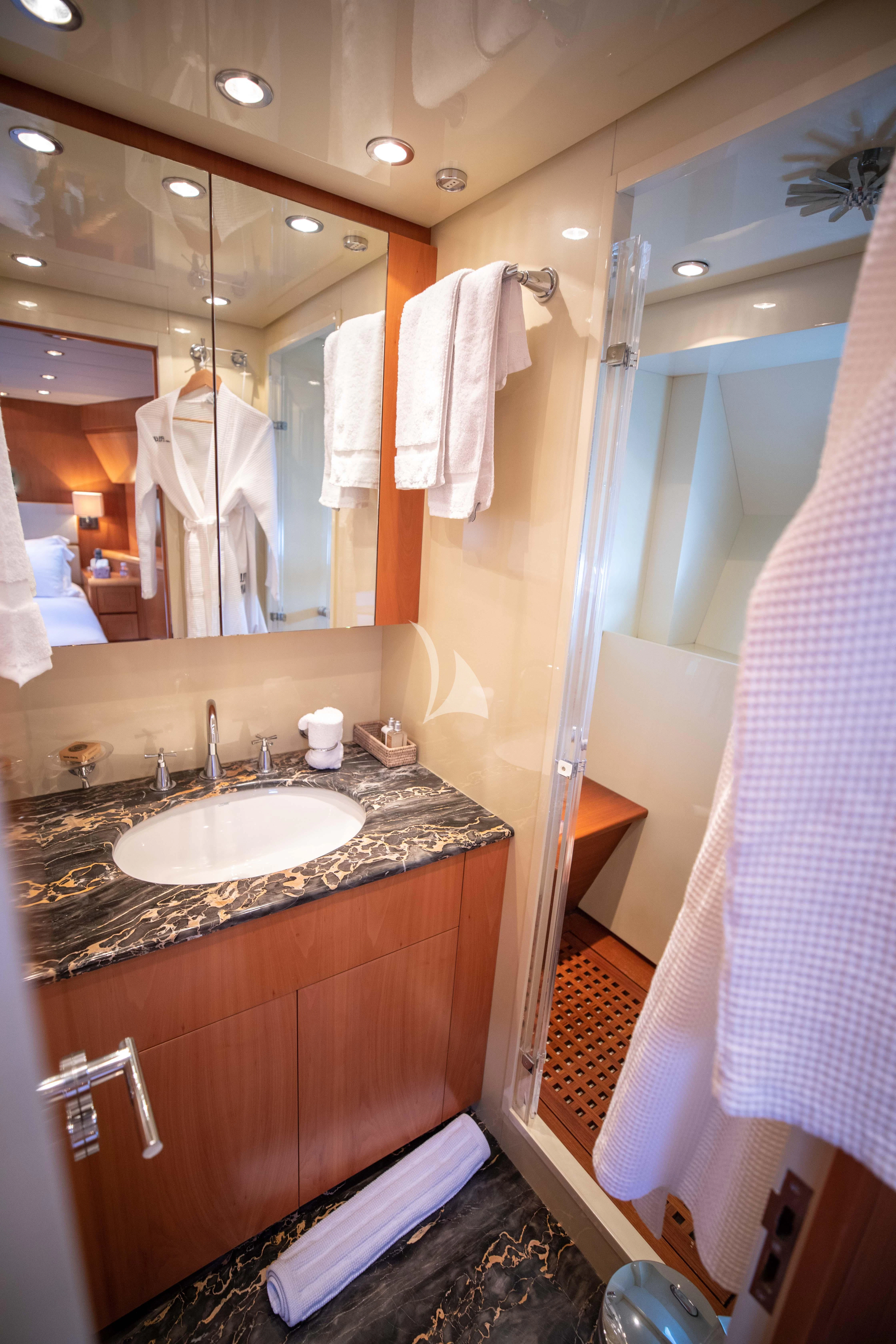 a bathroom with a sink and a mirror aboard ELLERY A Yacht for Sale