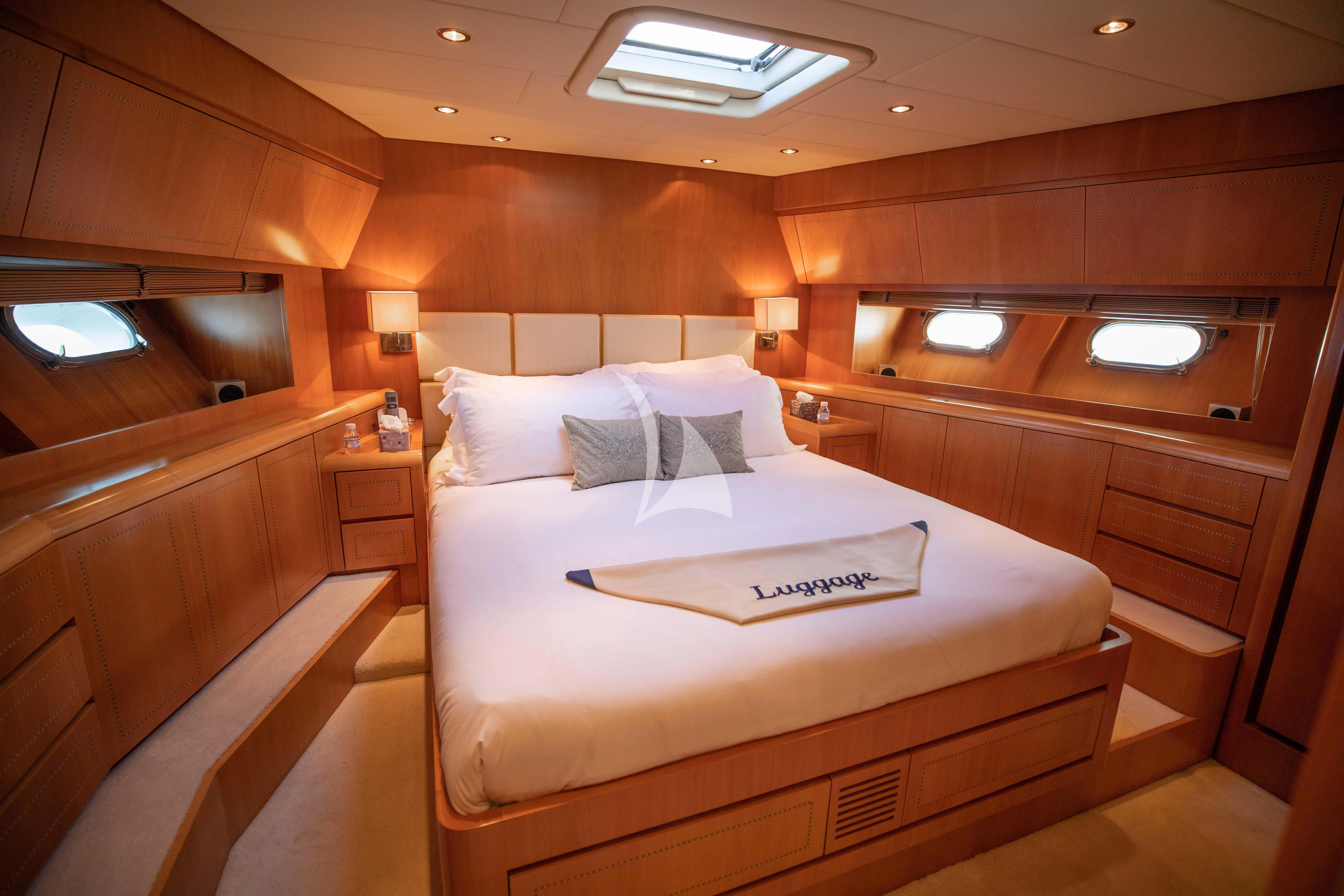 a room with a bed and a desk aboard ELLERY A Yacht for Sale