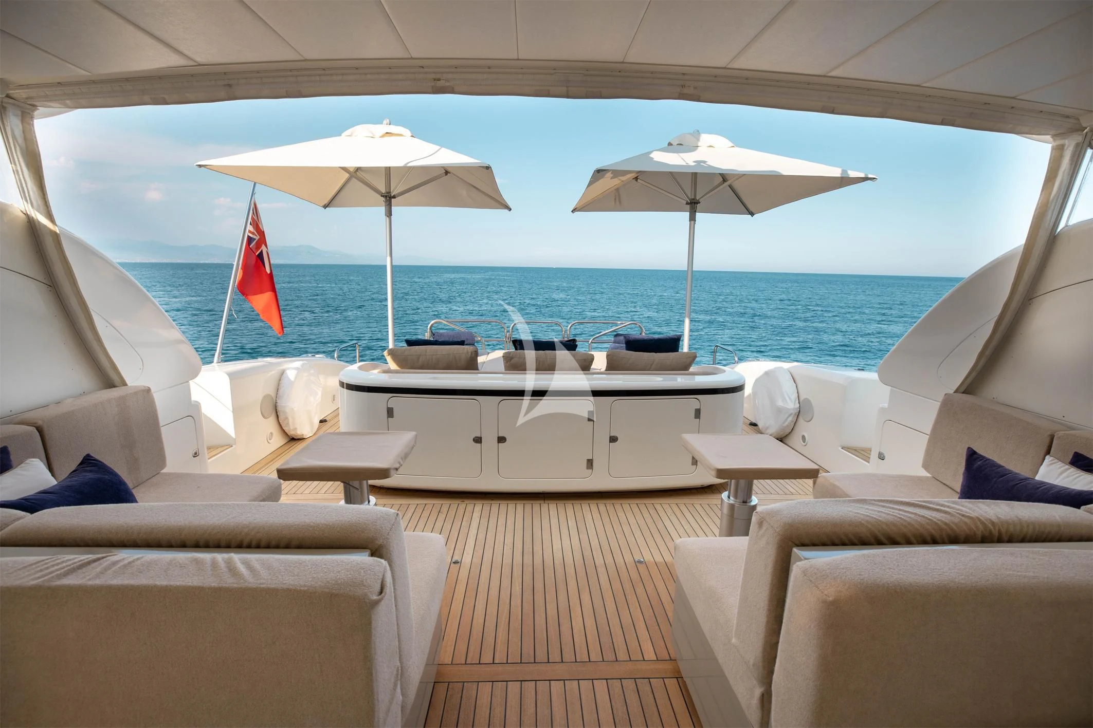 a room with a table and chairs and umbrellas aboard ELLERY A Yacht for Sale