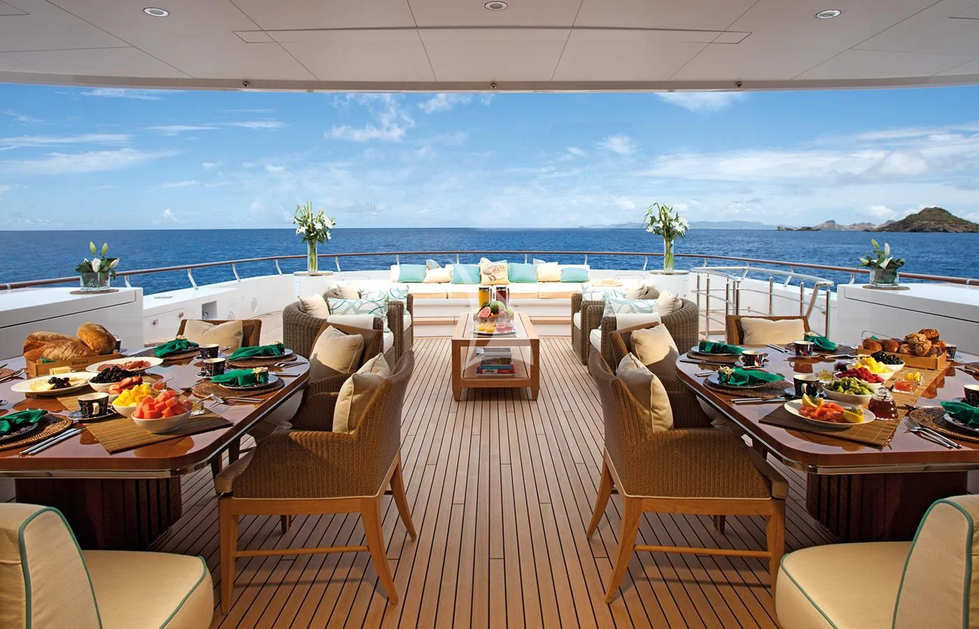 a room with tables and chairs aboard LADY BRITT Yacht for Charter