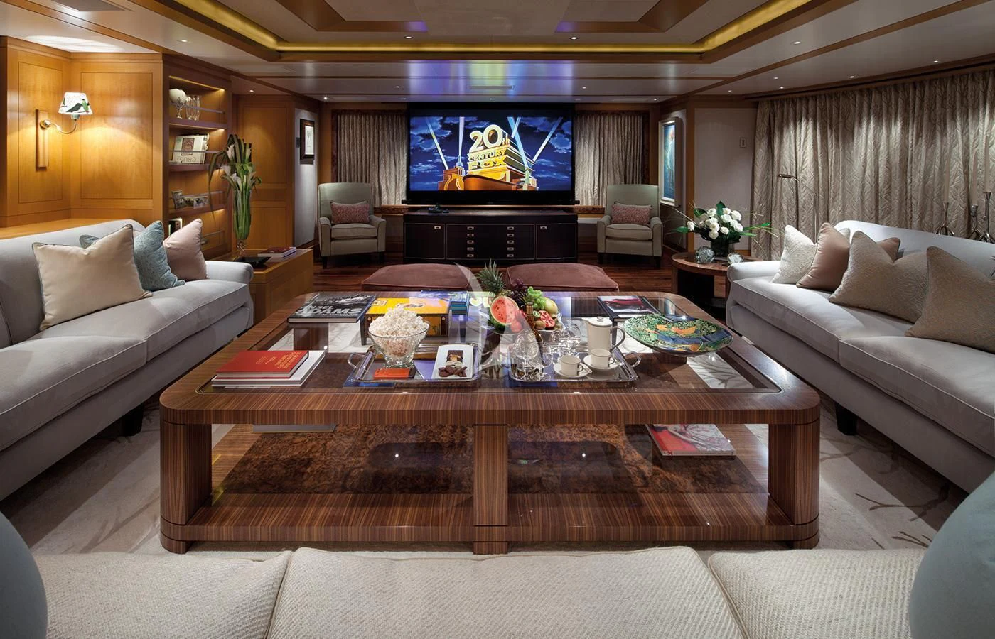 a living room with a table and couches aboard LADY BRITT Yacht for Charter