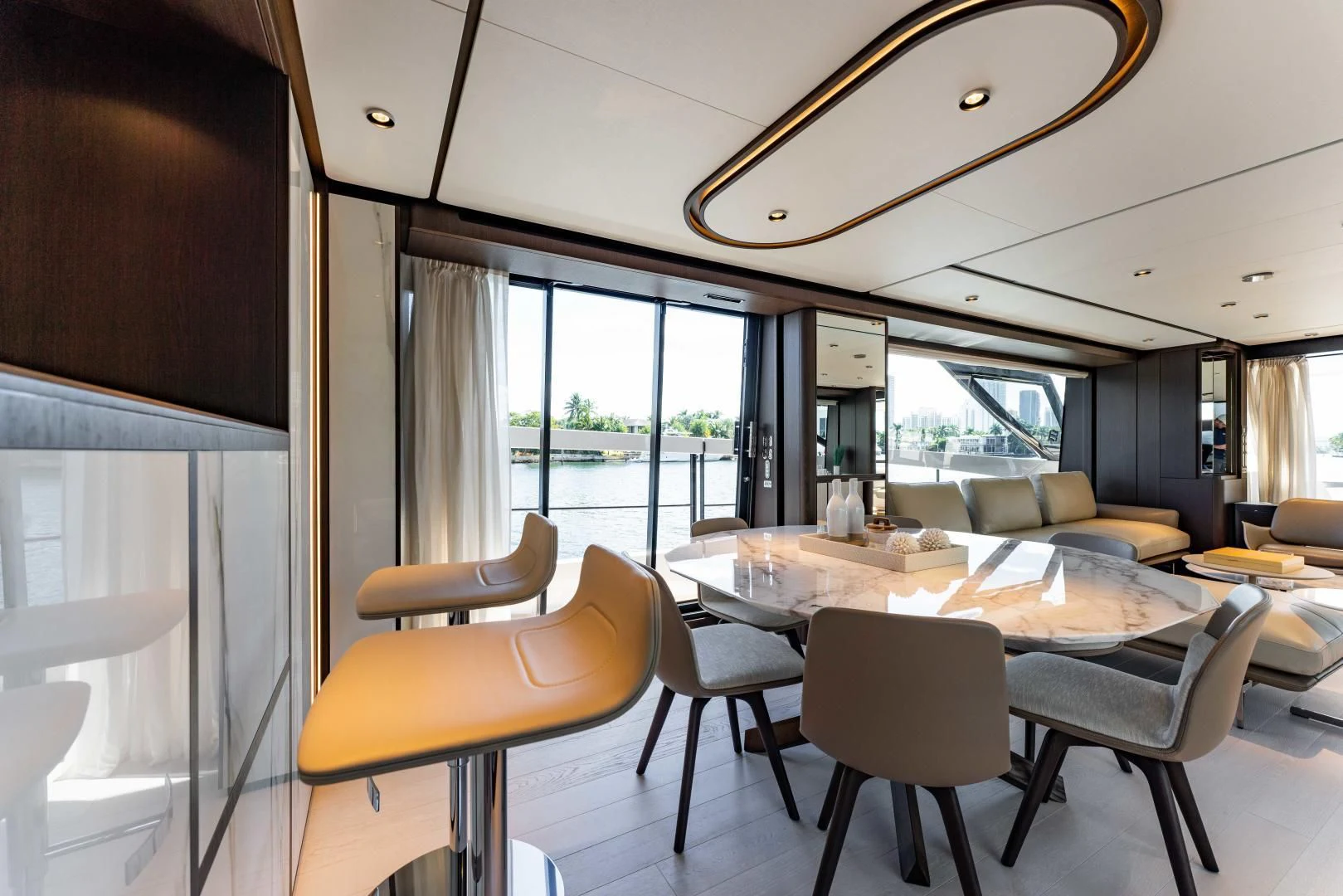 a large room with a table and chairs aboard BESO Yacht for Sale