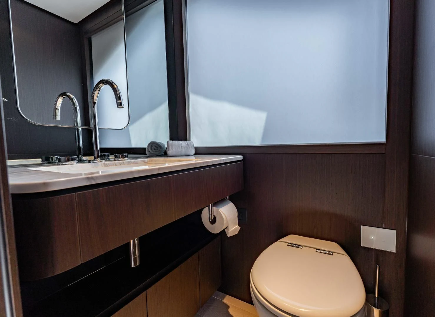 a bathroom with a toilet and a sink aboard BESO Yacht for Sale