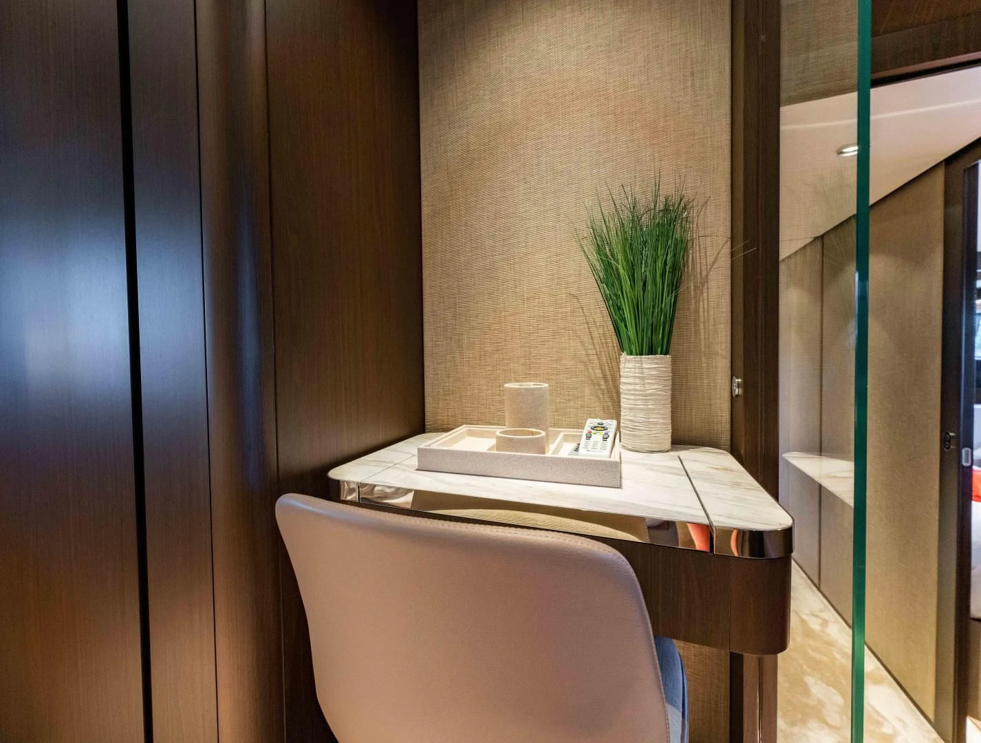 a chair and a desk in a room aboard BESO Yacht for Sale