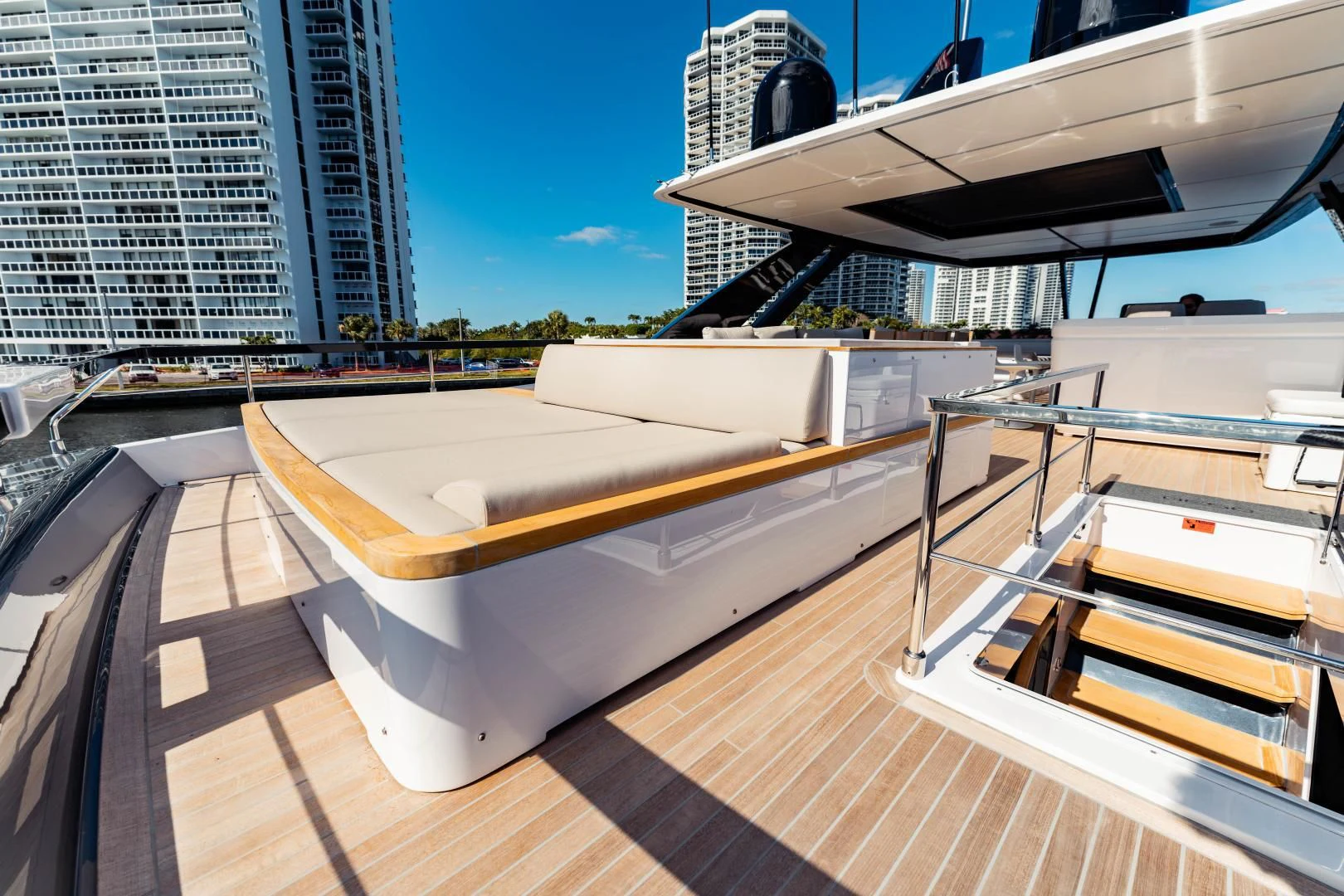 a deck with a large building in the background aboard BESO Yacht for Sale