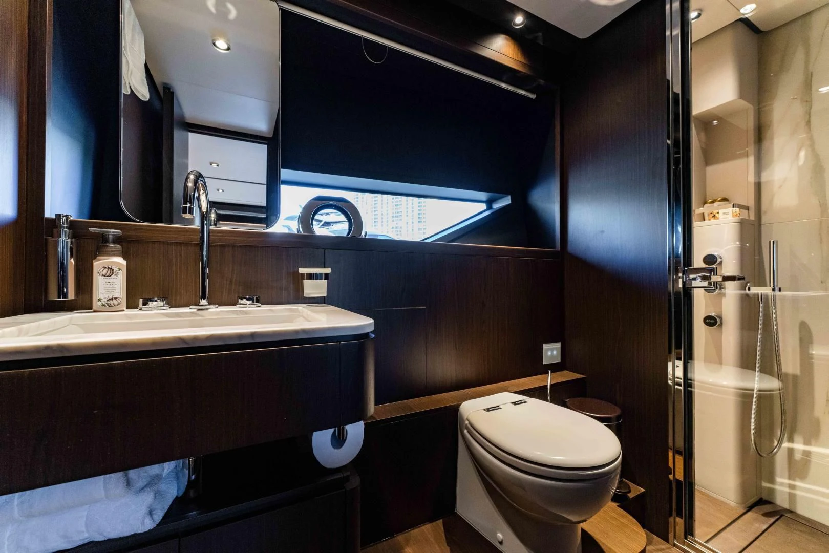 a bathroom with a sink toilet and a shower aboard BESO Yacht for Sale
