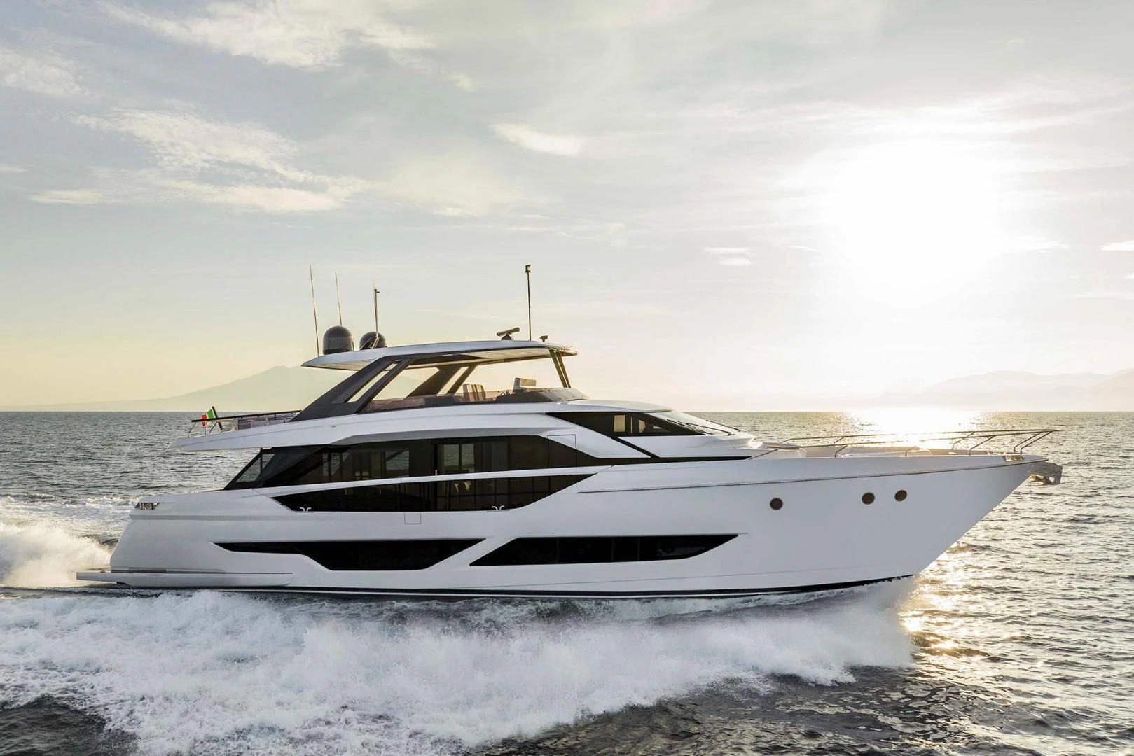 a white yacht on the water aboard BESO Yacht for Sale