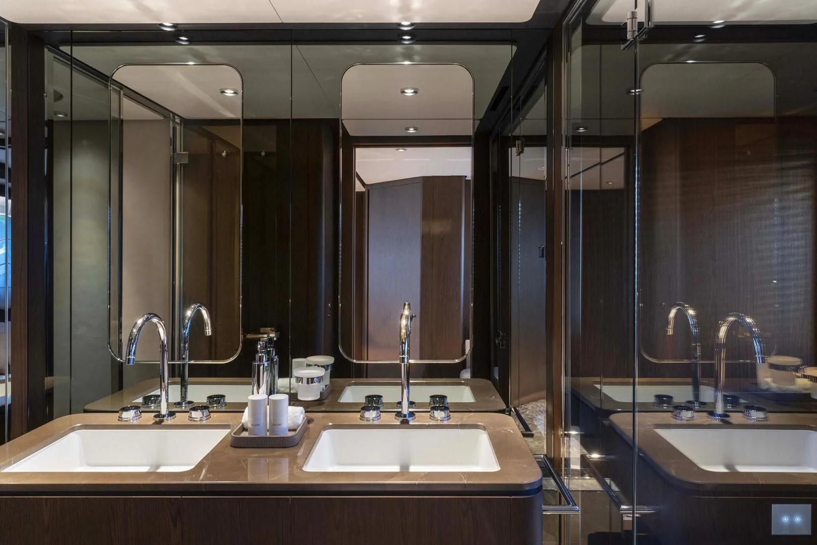 a bathroom with sinks and mirrors aboard BESO Yacht for Sale