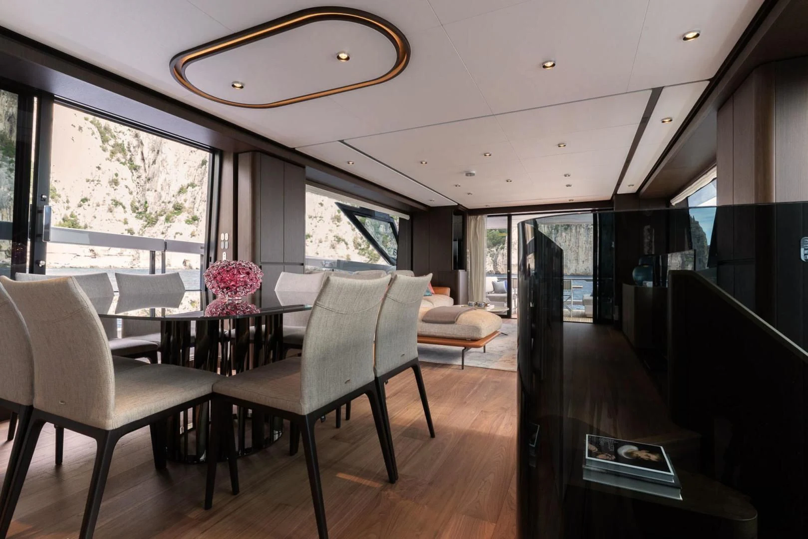 a room with a table chairs and a window aboard BESO Yacht for Sale