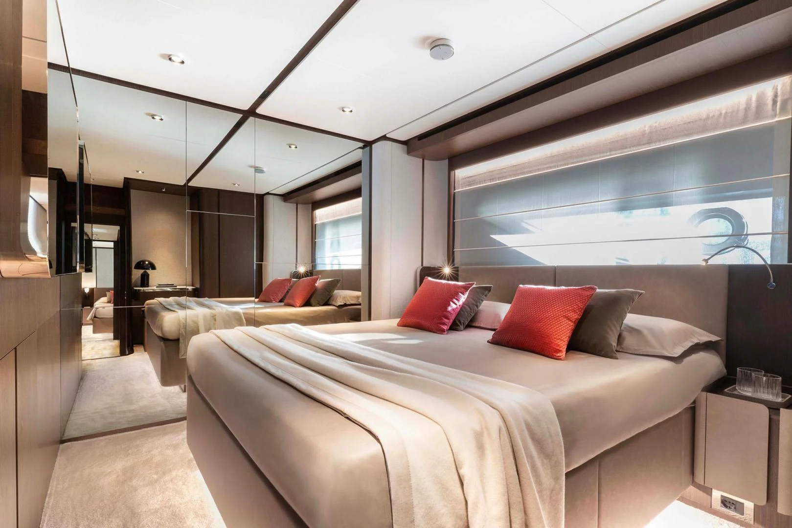 a room with a bed and a window aboard BESO Yacht for Sale