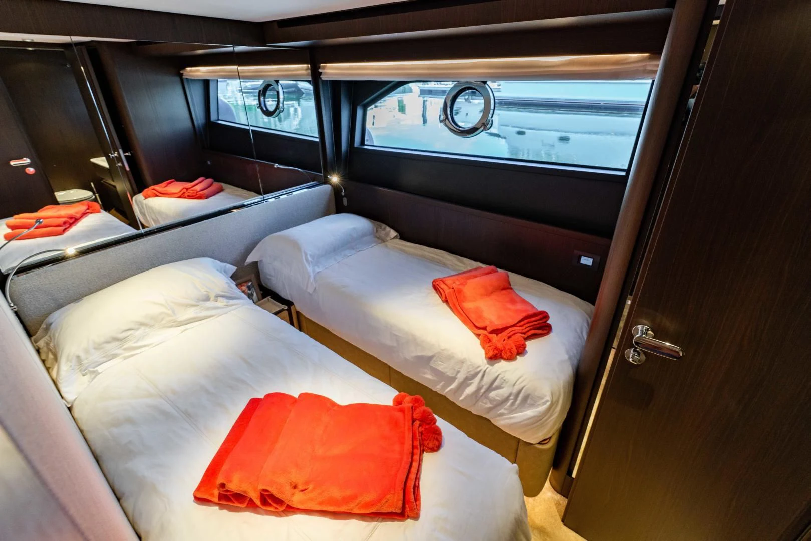 a room with beds and a window aboard BESO Yacht for Sale