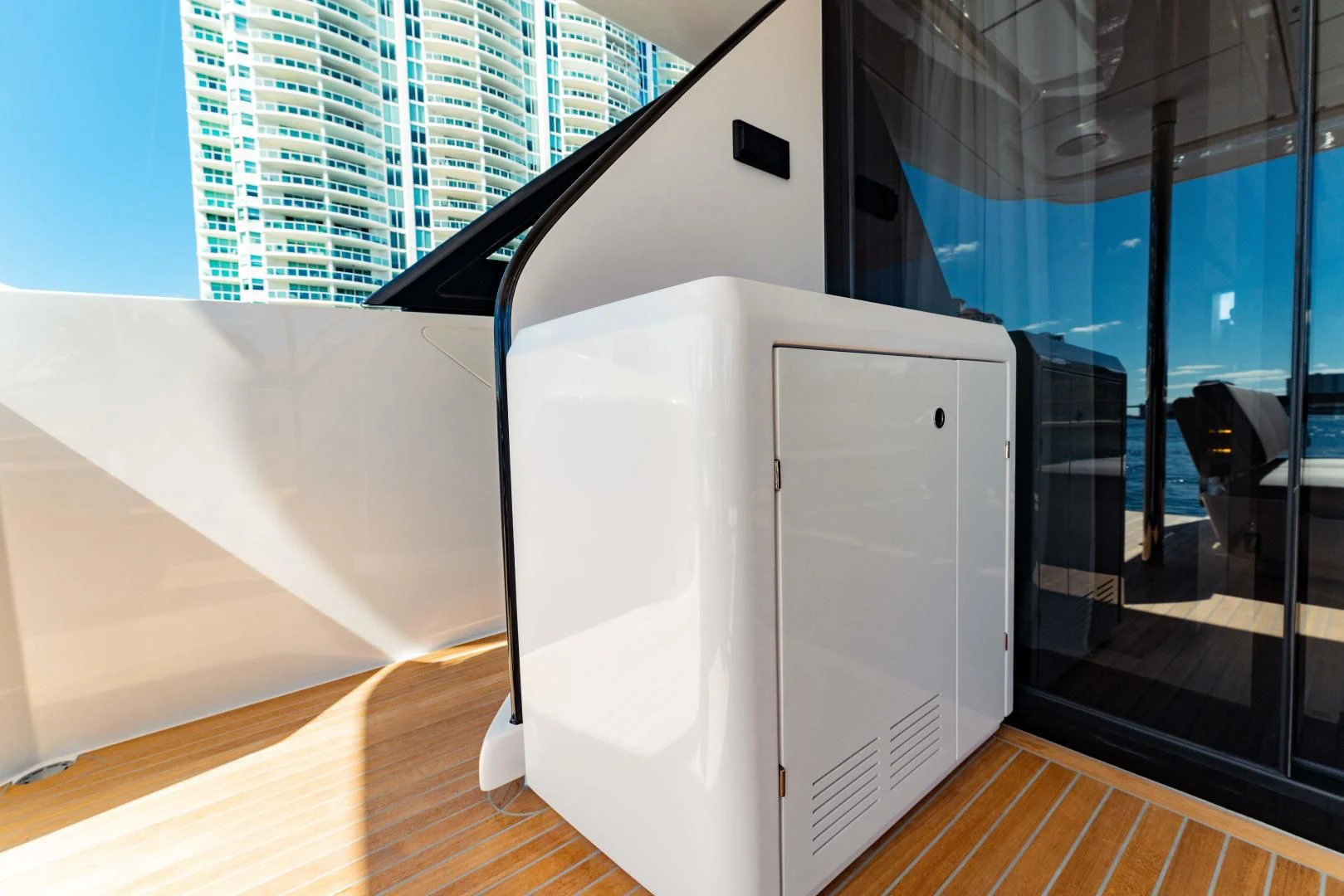 a large white box on a wooden floor aboard BESO Yacht for Sale