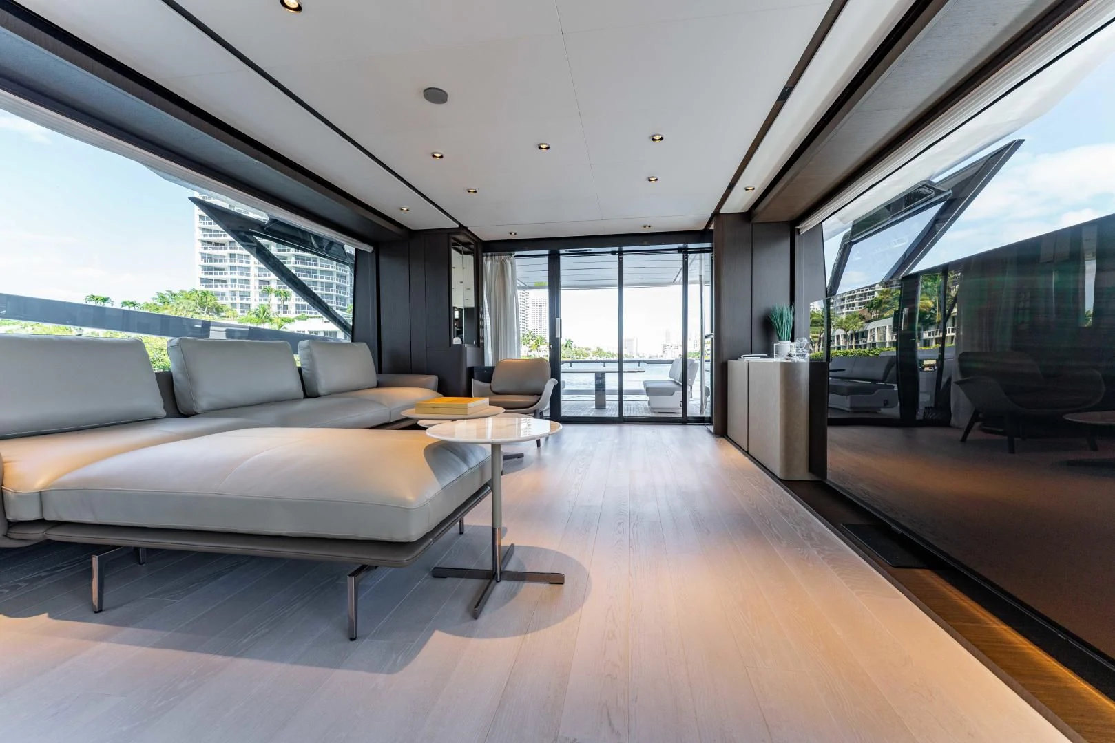 a living room with a couch and a table aboard BESO Yacht for Sale