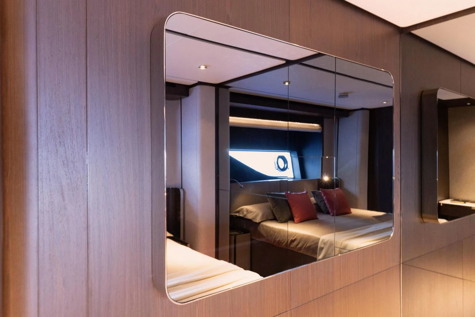 a room with a bed and a desk aboard BESO Yacht for Sale