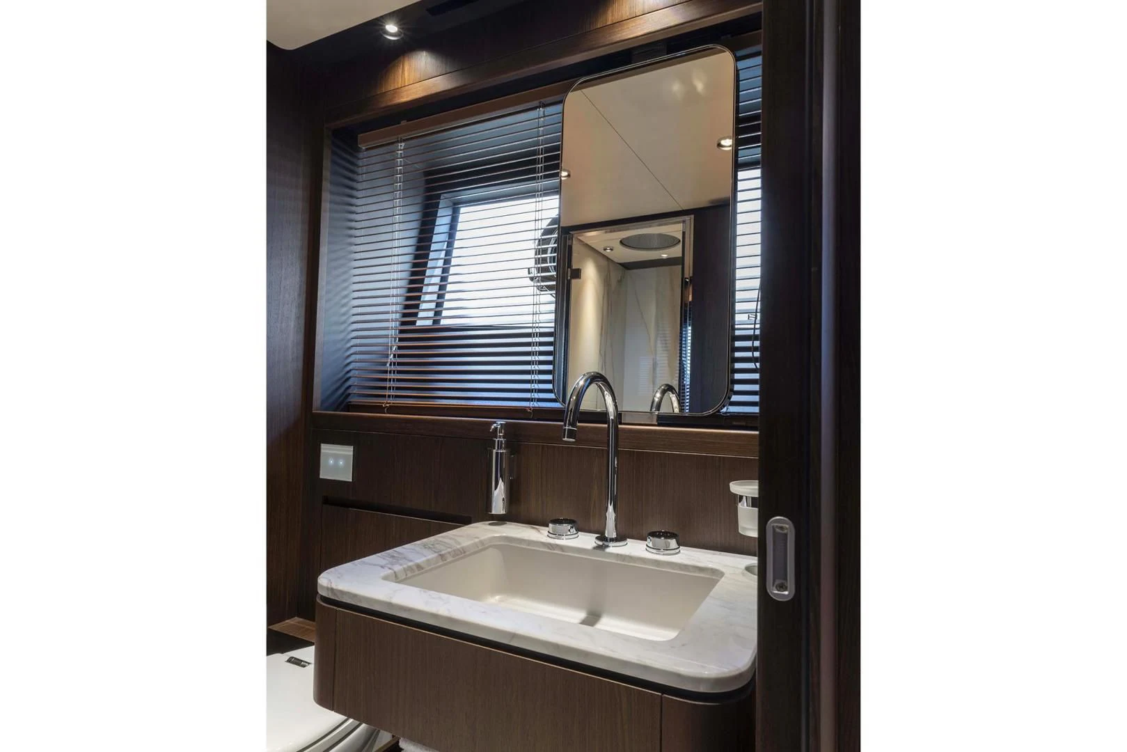 a bathroom with a sink and a large mirror aboard BESO Yacht for Sale