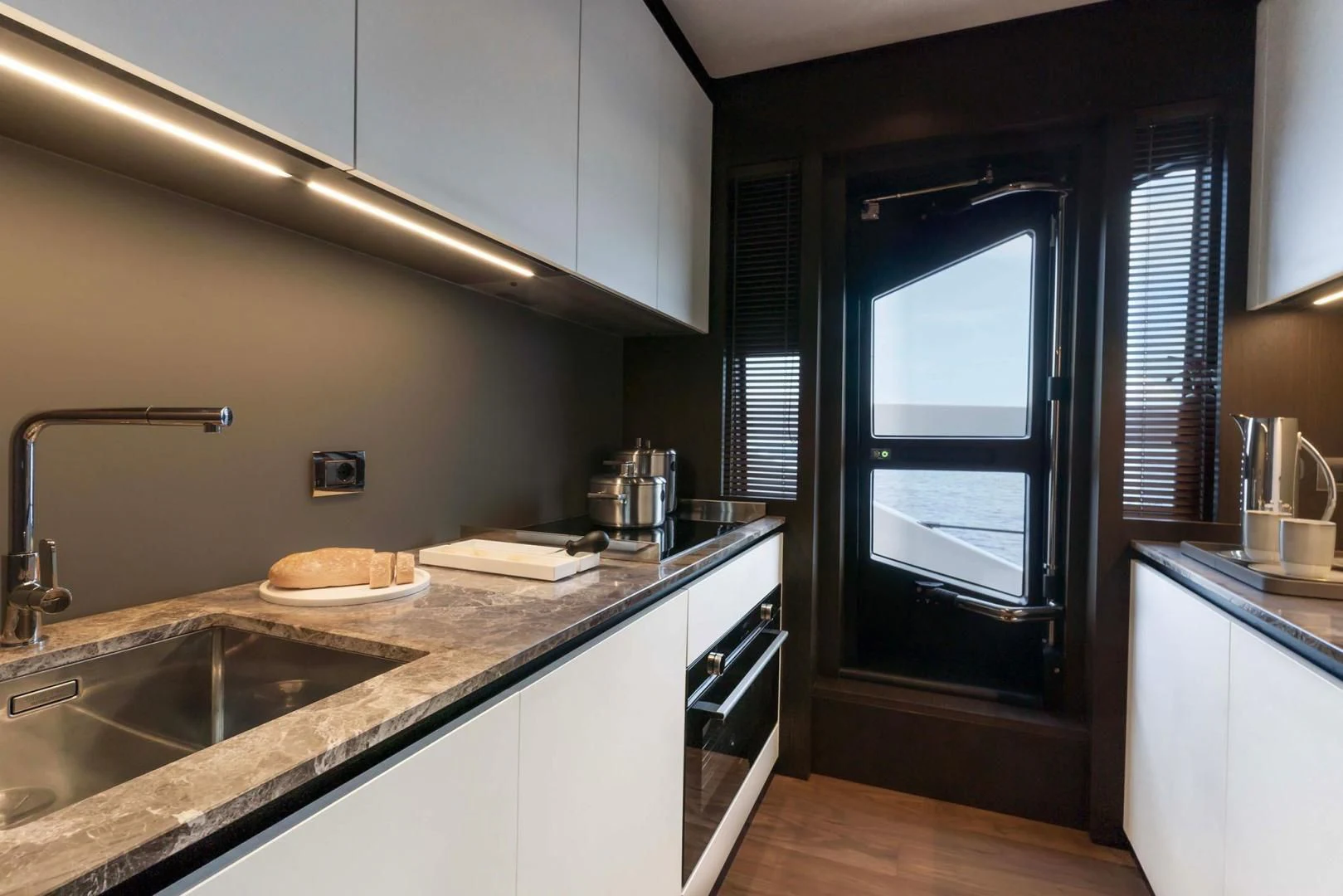 a kitchen with a sink and cabinets aboard BESO Yacht for Sale