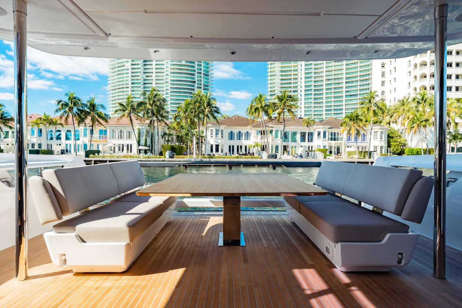 a room with a table and couches aboard BESO Yacht for Sale
