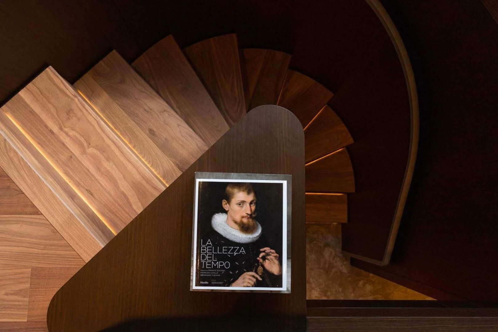 a framed picture of a person on a wooden chair aboard BESO Yacht for Sale