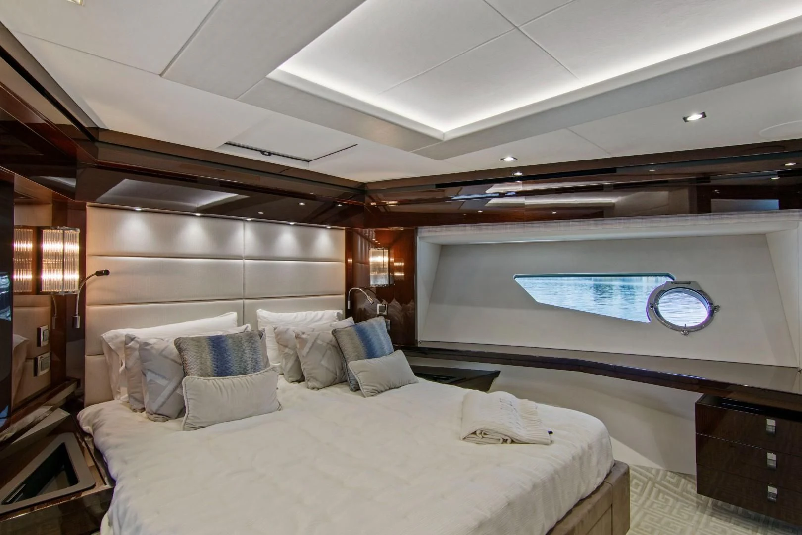 a room with a large bed and a large screen aboard GOLDEN OURS Yacht for Sale