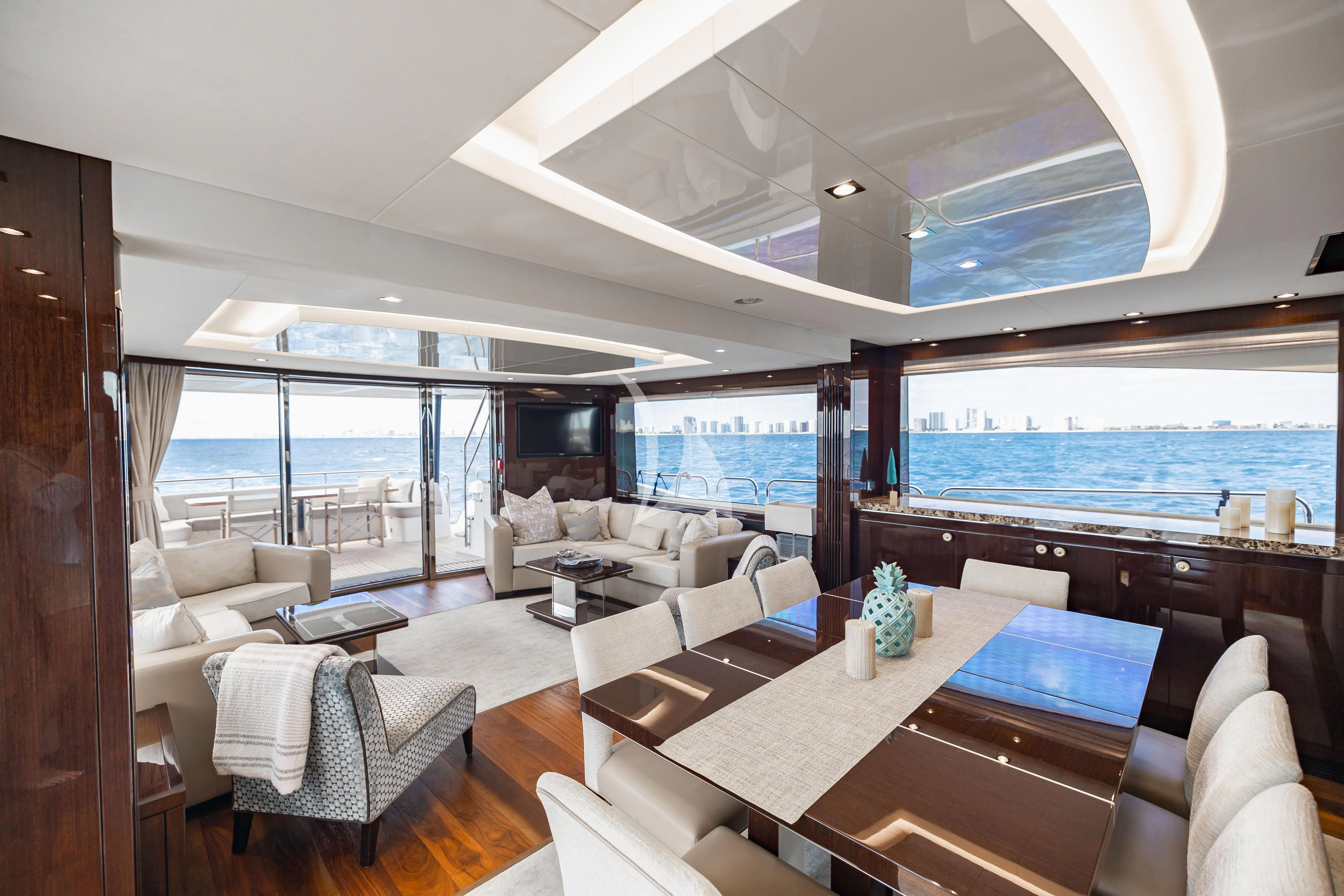 a living room with a large window aboard GOLDEN OURS Yacht for Sale